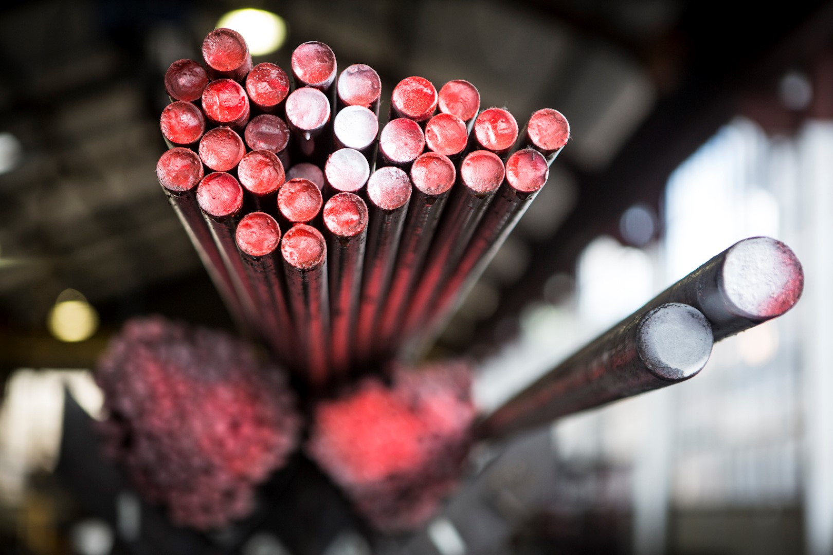 Mild steel raw material used to make threaded products (painted red)